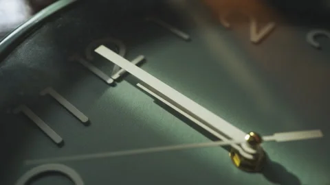 Close-up shot of hands of a wall clock at noon on 12 o' clock Stock Footage 293037088