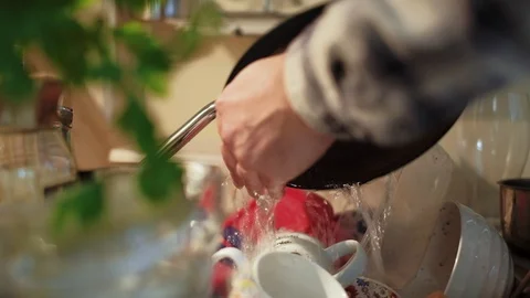 Close up shot of hands of  a young man washing dishes Stock Footage 95401414