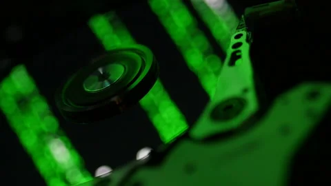 Close-up shot of hard drive covered in green matrix code Stock Footage 236357100