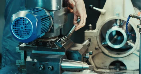 Close-up shot of a heavy industrial worker working on a metalworking process in Stock Footage 168467934