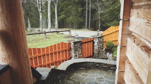Close Up shot of heavy Rain Falling on the porch of Forest Cabin. 4K. Stock-Footage 66755639