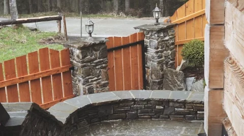 Close Up shot of heavy Rain Falling on the House Porch. SLOW MOTION 120 fps Stock Footage 66755767