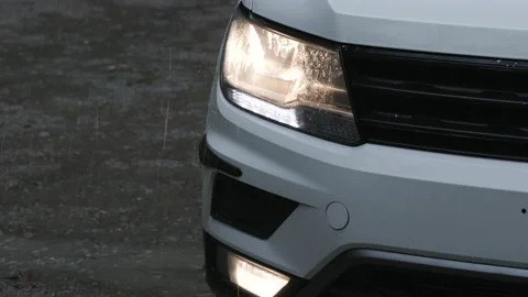 Close-up shot of heavy rain falling onto the passenger vehicle Stock Footage 232436189