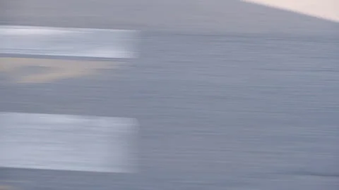 Close-up shot of highway asphalt surface from the fast moving car. Stock Footage 138512965