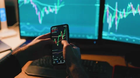 A close-up shot of his hands holding a smartphone and calculator Stock Footage 233540937
