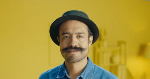 Close up shot of hispanic man smiling and looking at camera with a mustache and Stock Footage 171372704