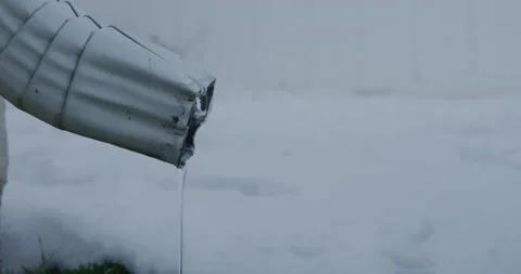 Close up shot of House Drain Pipe Drainage System Gutter After Snowstorm. Video stock 226609927