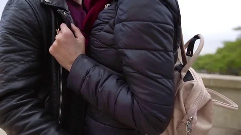 Close-up shot of a hugging young couple outdoor in autumn, smiling happy faces. Stock Footage 98895041