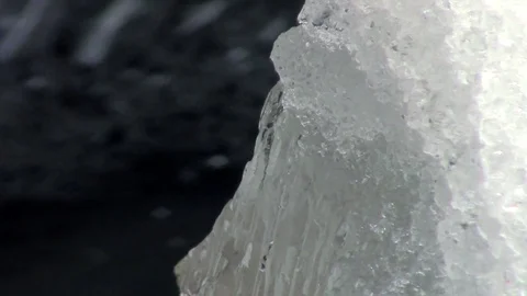 Close Up Shot of Ice with Water Flowing in the Background Stock Footage