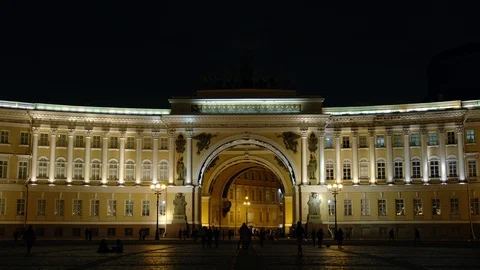 Close shot of Illuminated arch of General Staff and people in the night Stock Footage 85878472