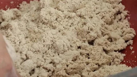 Close Up Shot of an Indian Man Kneading Wheat Flour Dough in a Bowl Stock Footage 333492354