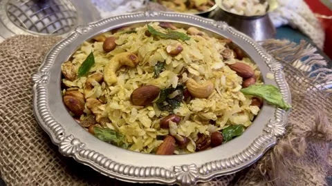 Close up shot of Indian Snack chivda namkeen garnished with cashew and peanuts Stock Footage 287176855