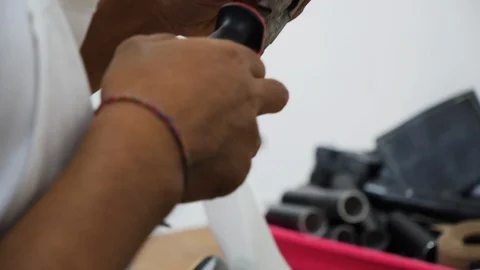 Close up shot of Indonesian man making prosthetic device, Bali Stock Footage 140260463