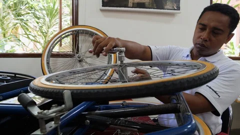 Close up shot of Indonesian man making prosthetic device, Bali Stock Footage 140303044