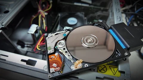 A close-up shot of the inside of a hard disk spinning to save data Stock Footage 342301830