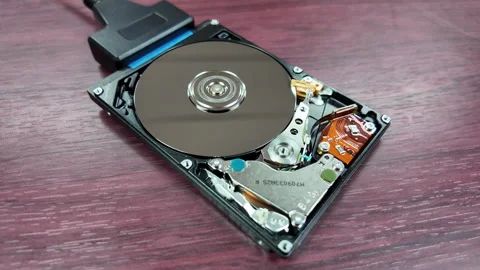 A close-up shot of the internal hard disk rotating to save data Stock Footage 342299182