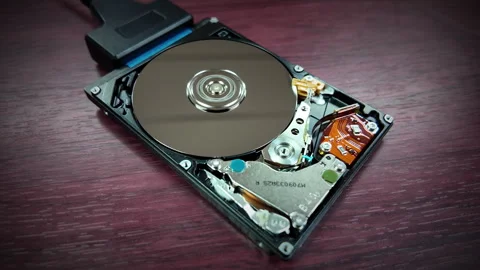 A close-up shot of the internal hard disk rotating to save data Stock Footage 342301814