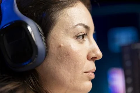 Close up shot of IT admin wearing headphones while increasing data security Stock-Fotos