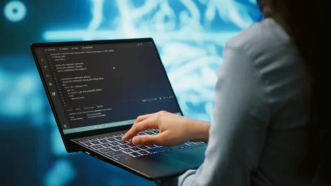 Close up shot of IT expert using AI system and laptop 写真素材
