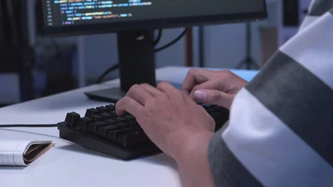 Close-up shot of IT freelancer's hand typing software code for application. Stock Footage 321664469