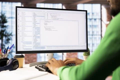Close up shot of IT worker using coding application, close up 写真素材