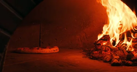 Close-up shot of Italian pizza preparing in stone oven. Pizza preparation in Stock Footage 247922752