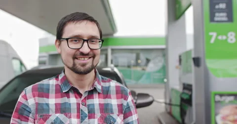 Close-up Shot Of A Joyful Handsome Man With Glasses Standing Near His Car While Stock Footage 149796690