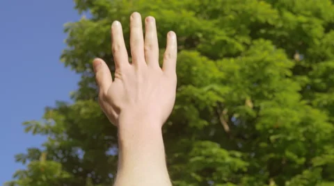 Close-up shot of keeping a one hand up in the clean air Video stock 67253957