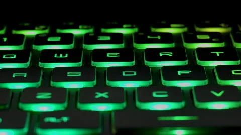 Close shot of keyboard with keys lighting in multi color light Stock Footage 145475310