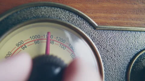 Close up shot of knob turning for changing volume on a vintage radio Stock Footage 273120888
