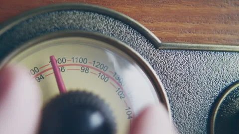 Close up shot of knob turning for changing volume on a vintage radio Stock Footage 273120891