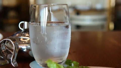 Close up shot of laptop with code on screen, glass and bottle of water, notebook Stock-Footage 313809288