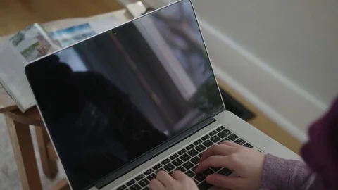 Close up shot of a laptop screen featuring lady typing Stock Footage 70809628