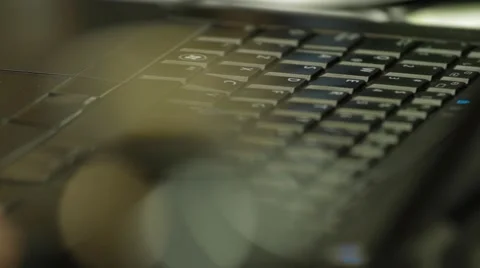 Close Up Shot of a laptop's keyboard inside a company's headquarters Stock Footage 45236242