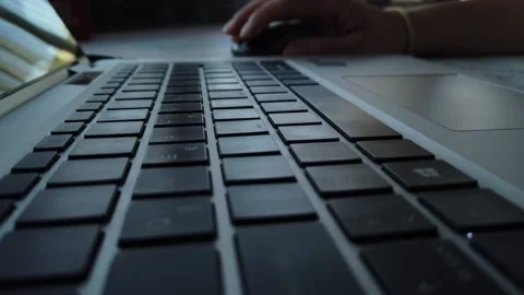 Close up shot of laptops keyboard while a woman is typing a message. Stock Footage 138815888