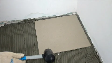 Close up shot of laying tile on the floor Stock Footage 65287862