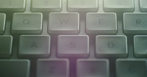 Close-up shot of a left hand hitting the W A S D keys on a Mac keyboard. Stock Footage 100969972