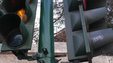 Close-up shot from left to right of a traffic light pole in Rome, Italy Stock Footage 303732947