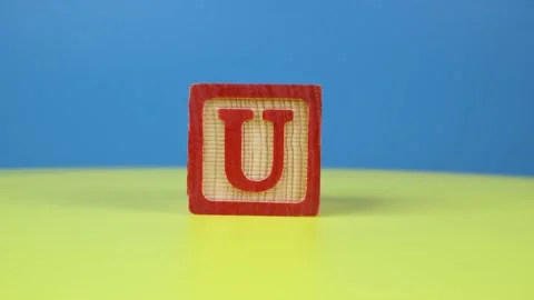 Close up shot letter "U" alphabet wooden block Stock Footage 166718307
