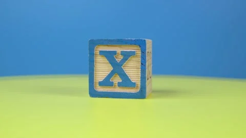 Close up shot letter "X" alphabet wooden block Stock Footage 165934548