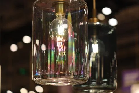 A close-up shot of a light hanging from a ceiling, great for interior design or Stock Photos