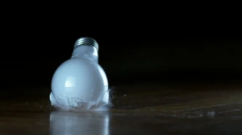 Close shot of lightbulb falling and breaking bulb-first in super slow motion 스톡 동영상 60263583