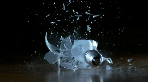 Close shot of lightbulb falling and breaking in slow motion with speed ramp 스톡 동영상 60264069