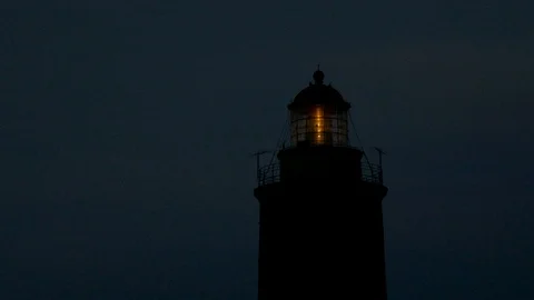Close shot of Lighthouse Illuminated In Night and darkness Stock Footage 98159664