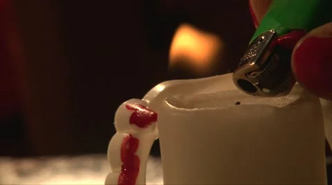 Close up shot of lighting white candle with a lighter and being blown out Stock Footage 68019138