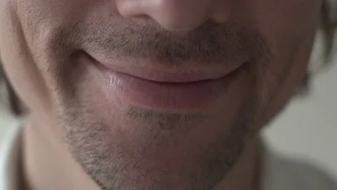 Close Shot of Lips of Unshaved Smiling Young Man Stock Footage 154659267