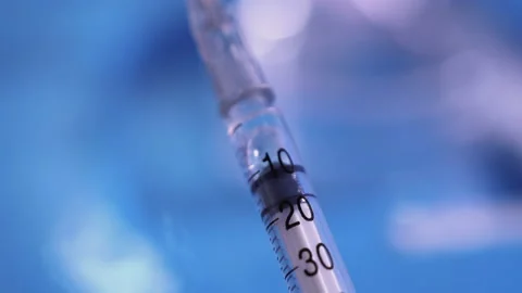 Close-up shot of liquid injected inside a syringe. Stock Footage 197099841