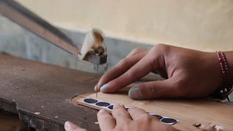 Close up shot of local man cutting circles with wood cutting tool, Bali Stock Footage 140250968
