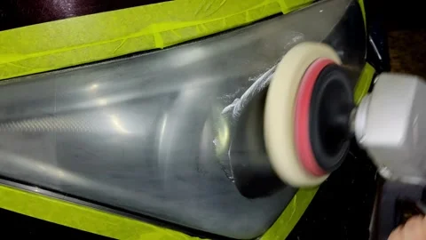 A close-up shot of machine polishing a car headlight Stock Footage 336273352