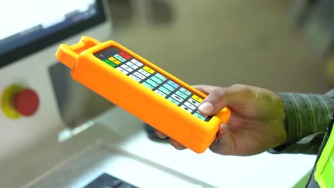 Close Up Shot Of A Machinist Operating A CNC Machine By Using A Computerized Stock Footage 332400170